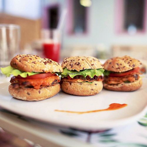 Three small aubergine burgers at Rawmazing in Bucharest