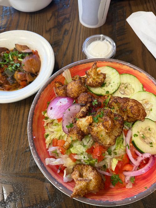 Rice bowl with cauliflower and side of veggies at Laziza Mediterranean Grill - Augusta in Augusta