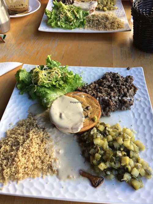 Main was a tart with savoury lentils, a grain, sauteed zucchini and salad at La Petite Marche in Dijon