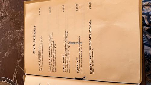 Main corses menu - garden tomato stuffed with caponata is vegan  at Idyllium in Pienza