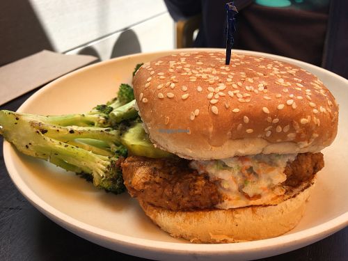 Chick’n burger with slaw on top, roasted broccoli on side at Veggie Grill in Corte Madera