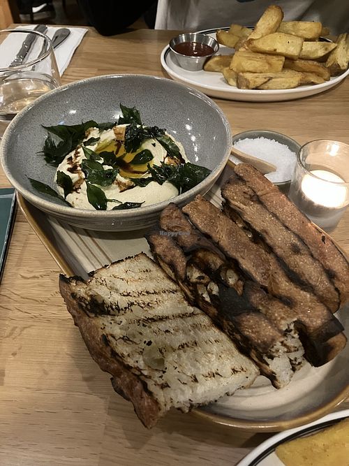 Indian hummus with charred bread  at The Grocer in Tauranga
