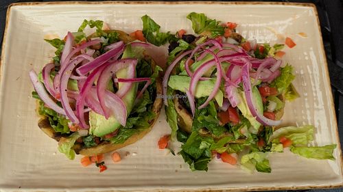 Sopes La Maria! Thick corn tortilla cups, no cheese/crema, refried/black beans, avocado, pico de gallo, & lettuce. Ask for hot sauce & pickled onions to maximize flavor!  at Manolete's Cocina Gourmet in Winchester
