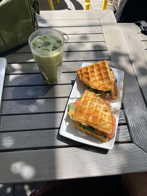 waffle sandwich with vegan cheese, tomato, spinach, and spicy mayo  at RELAY Coffee Roasters in Hamilton