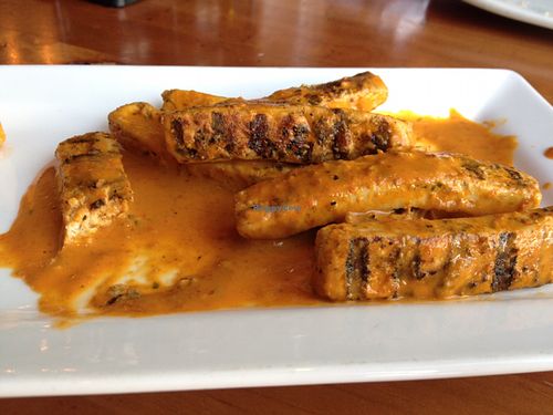 Red Thai Curry vegan wings (partially eaten) at Picazzo's Healthy Italian Kitchen in Scottsdale