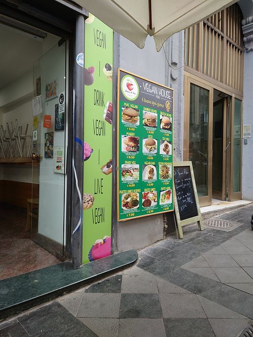 Menu on the wall outside at Vegan Art in Naples
