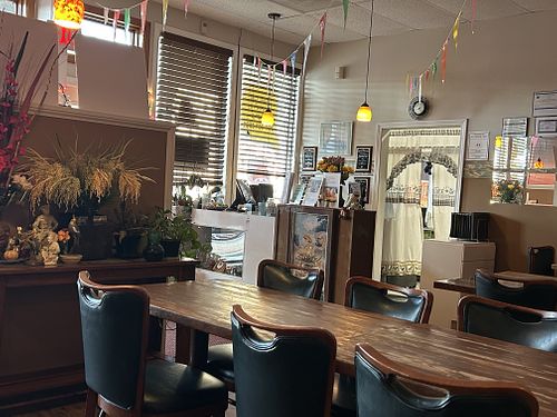 Small cozy dining room with standard seating arrangements for 4 and 8 guests  at Thai For You in York