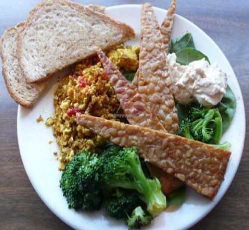tempeh scramble: fried tempeh wedges, scrambled spicy seasoned tofu and steamed broccoli on a bed of spinach. at The Wayward Cafe in Seattle