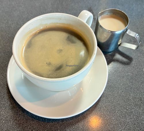 Americano with oat milk  at Warehouse Café in Manchester