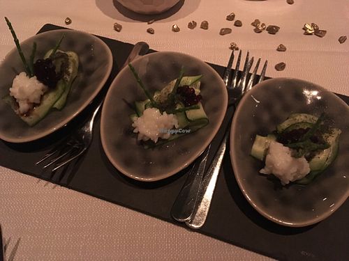 appetiser with sliced cucumber, sushi rice, sea asparagus, seaweed powder and soy sauce caviar at TIAN Munich in Munich