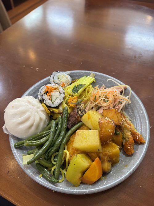 Mushroom and vegetable bao, plus a whole bunch of options.  at Nhà Hàng Chay Nhà Tấm - Vegan Restaurants in Lam Dong