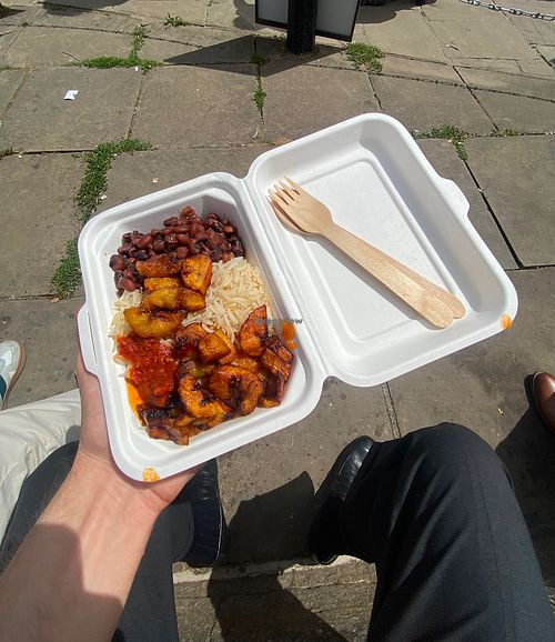 Rice with black beans, fried plantain, and spicy veggie sauce  at Africfood RESTAURANT in Cambridge