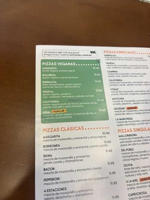 Green are vegan pizzas on menu  at Del Poble Pizzeria Eixample in Barcelona