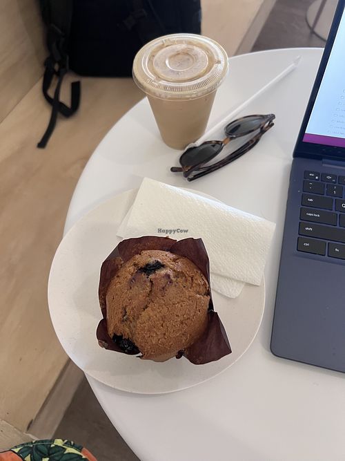Vegan blueberry muffin and vegan oat milk latte  at Our Mutual City Coffee in Chicago