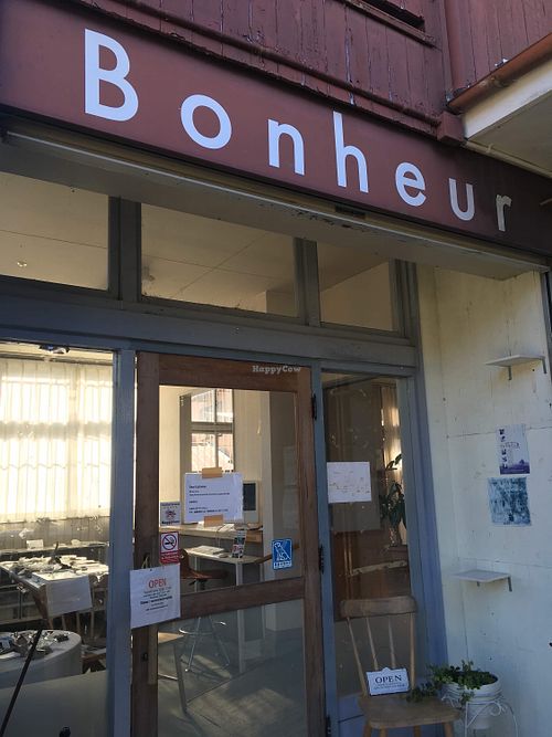 Sign on side of building at Cafe Bonheur in Tanabe