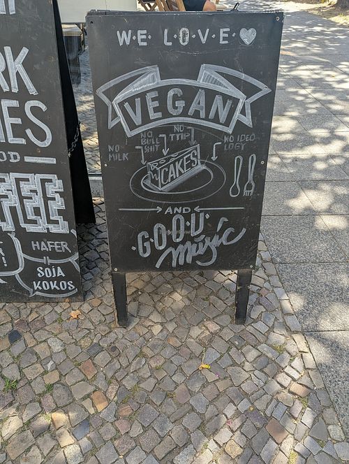 Sign promoting vegan cakes at uppers coworking in Berlin