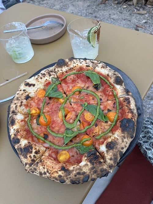 Vegan pizza of the day (sourdough crust, vegan cheese, tomatoes, basil, basil pesto)  at Tender Fire Kitchen - The Restaurant in Santa Fe