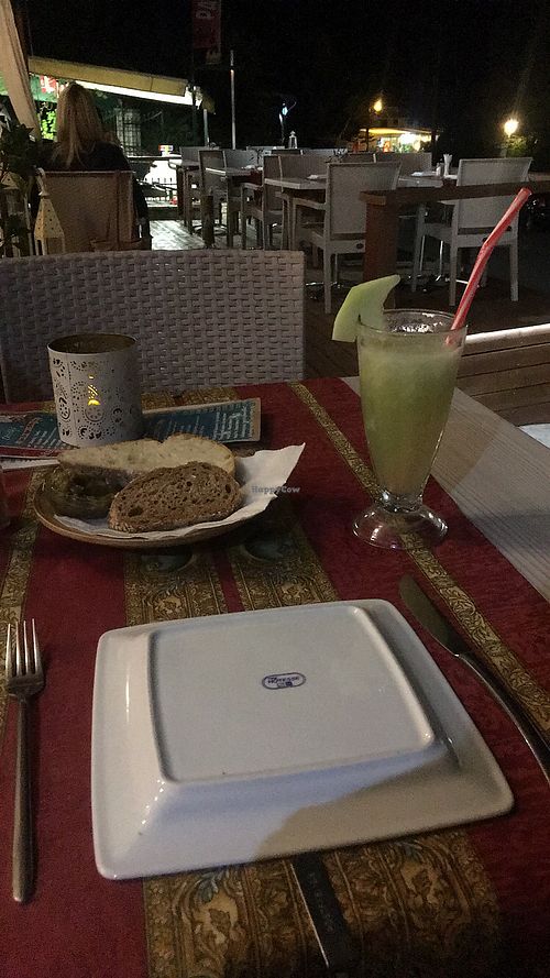 Fresh melon juice and bread with aubergine dip  at Gran Aladino in Corfu