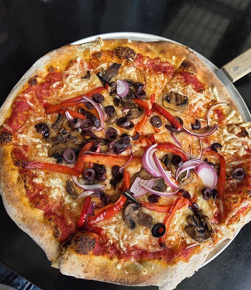 Mediterranean Pizza with vegan cheese at Brickyard Hollow in Brunswick