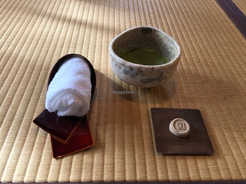 Matcha and pressed sugar sweet to begin the meal  at Kakusho in Takayama