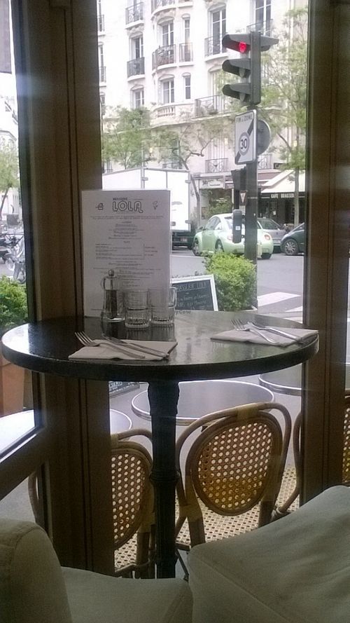 une petite table de deux, intime et typiquement parisienne at Brasserie LoLa in Paris
