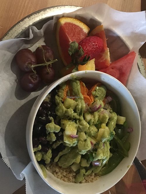 Can’t remember the name of this bowl. Has quinoa, avocado, black beans, peppers, and sweet potatoes. A side of fruits.  at The Corner Store in Plant City