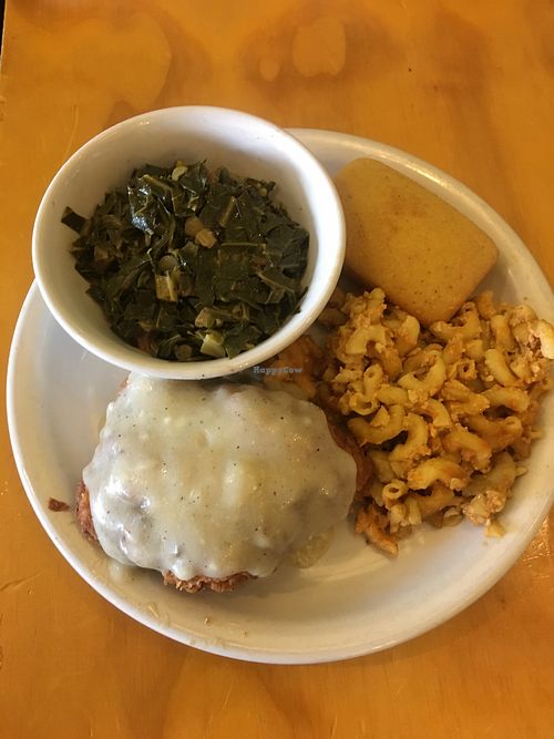 Yum! Smothered fried chicken with gravy and mac n cheese, collard greens and cornbread  at Go Vegan Grill in Decatur