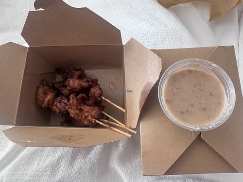 Satay “chicken” skewers w/ peanut sauce  at Boualouang Laos & Thai Cuisine in Edmonton