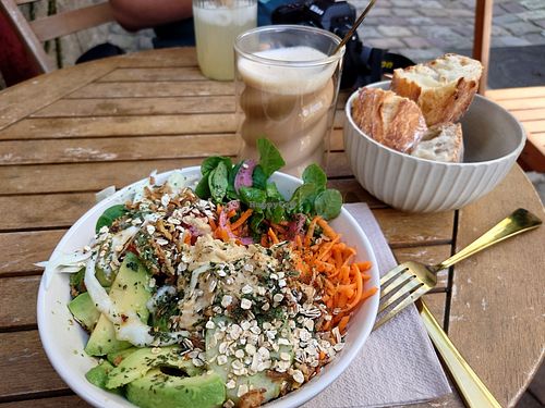 Vegan bowl and coffee with oat milk. at Café Littéraire Dos Hermanas - Cafe Dinan in Dinan