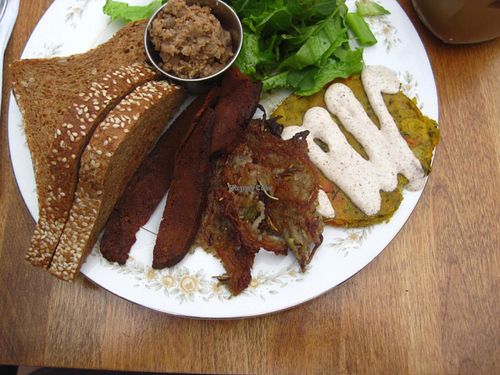 Brunch : buttered toasts, vegan cretons, salad, seitan bacon, hashbrowns and chickpea omelet with tarragon cream sauce. at Antidote Bouffe Vegane in Montreal