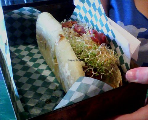 Reggie Jefferson Hot-Dog : chorizo, aioli, hot peppers, served in a ciabatta.

This doesn't taste or look like a hot-dog, but it's amazing. I particularly liked the sausage and the sprouts here. at Antidote Bouffe Vegane in Montreal