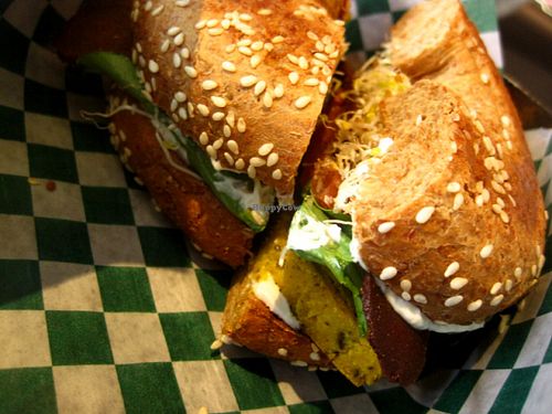 This is the 'Petit Déj'' (literally 'breakfast) : seitan bacon and chickpea omelet served in a bagel with veganaise, lettuce and sprouts. This was filling and very delicious.  at Antidote Bouffe Vegane in Montreal
