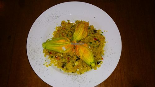 Vegetable Cous Cous with zucchini flowers stuffed with vegan cheese. at Fargo in Sevilla