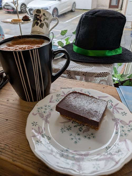 Chai latte with oat milk and chocolate and coconut torte. at Blyde Welcome in Shetland Islands