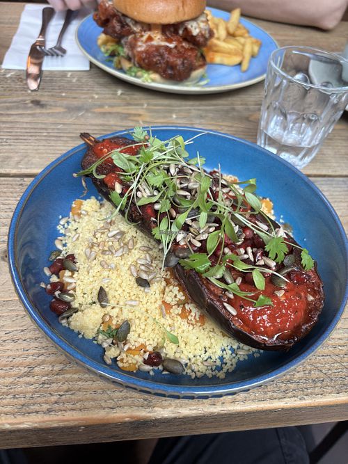 Harissa Aubergine with apricot couscous (spicy)  at The Lockheart Tavern in Haywards Heath