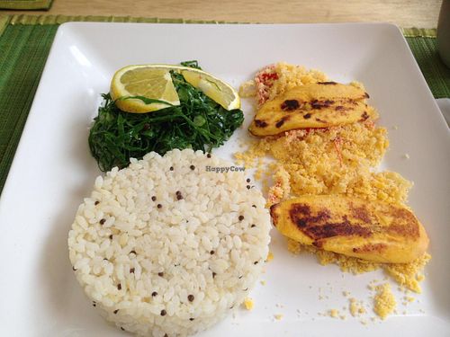 Main dish: rice, glam, grilled banana, cabbage. at Espaco Surya in Sao Paulo