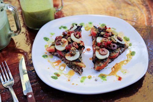 delicious raw pizza. bursting with flavour  at Raw Love - Ahau Tulum Beach in Tulum