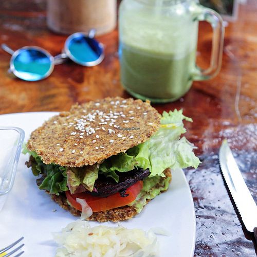 yummy mostly raw portobello mushroom burger with sauerkraut, jicama fries and an iced matcha latte made with house made mylk from locally grown coconuts at Raw Love - Ahau Tulum Beach in Tulum