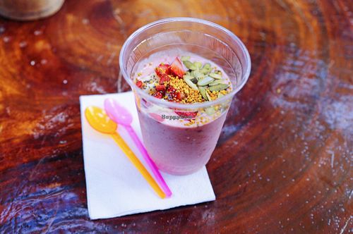 delicious coconut yoghurt parfait topped with strawberries pumpkin seeds bee pollen and bananas on the bottom at Raw Love - Ahau Tulum Beach in Tulum