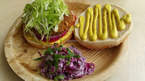 Vegan burger with Indian sauces and coleslaw. at Alegria in Tel Aviv