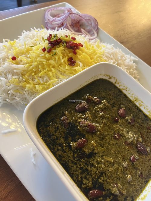 vegan ghormeh sabzi with saffron rice topped with dried barberries and slivered pistachio   at Santoor in Wien