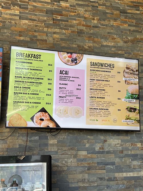 Menu with a few labeled vegan options  at Pluto’s Organic Cafe in Redmond