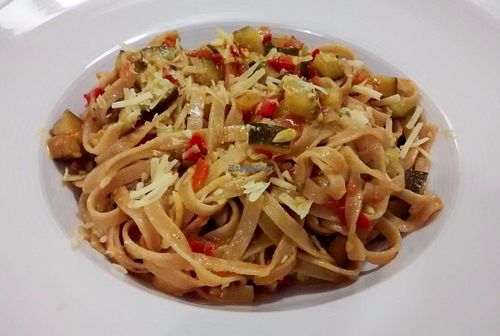 Tagliatelle with zucchini, tomato, sunflower seeds, and curry. at Logud'Oro in Sassari