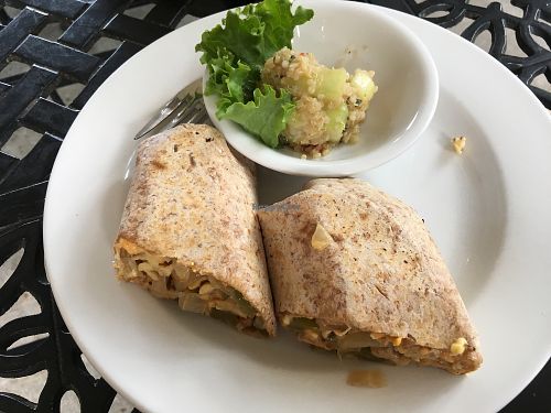 Philly cheesesteak wrap (made with tempeh!). The cucumber quinoa salad is bomb.  at Bay Naturals Healthy Market & Kitchen in Myrtle Beach