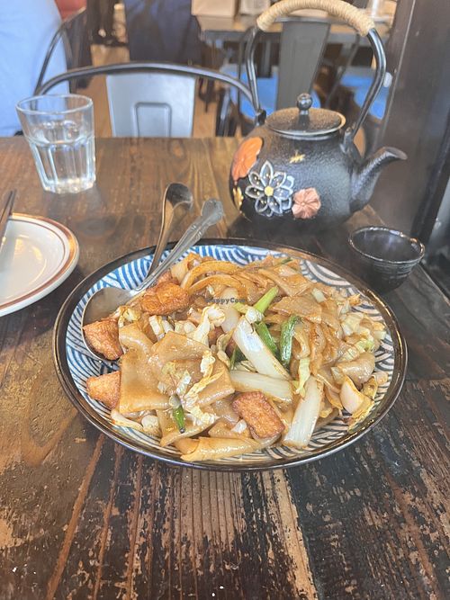 Flat noodles with tofu and pot of Jasmine tea  at United Dumplings in San Francisco