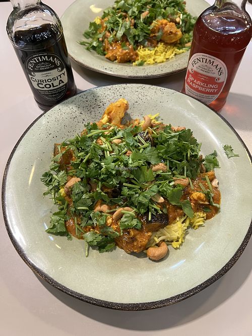 Tofu veggie curry with roasted cashews and sliced basmati rice  at Roots Kitchen in Turku