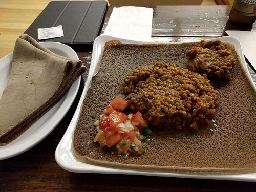 Misir Wat (Lentil stew, the larger portion) and Shiro (seasoned pea flour paste, smaller portion) on injera at Nile Ethiopian in Richmond