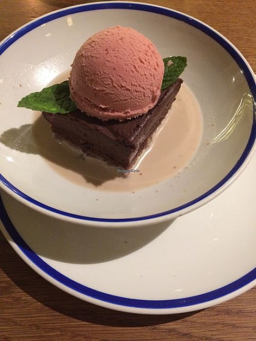 Their most popular dessert: chocolate cake topped with homemade vegan strawberry ice cream. at Flax & Kale - Placa Castella in Barcelona