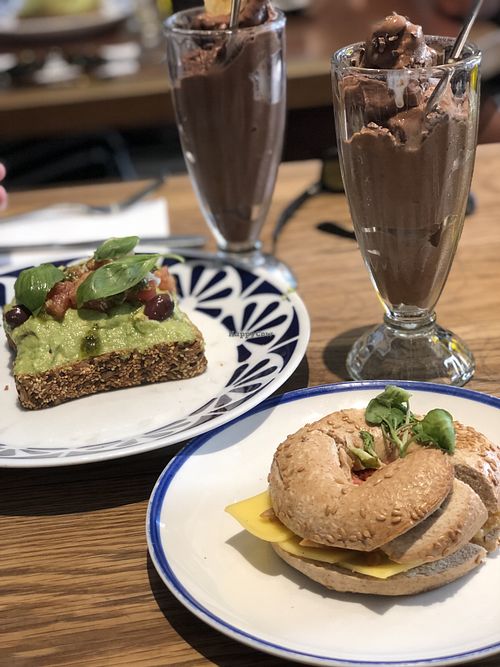 Vegan bacon cheese bagel with banana and coffee smoothie  at Flax & Kale - Placa Castella in Barcelona