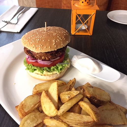 fat pumpkin burger, potato wedges and vegan mayonnaise at Green Pumpkin in Riga